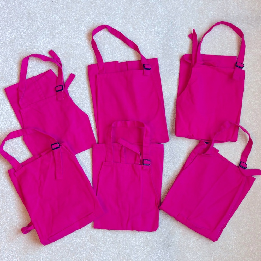 6 NEW kids aprons - sturdy canvas in fuschia pink.  Selling as a lot of 6